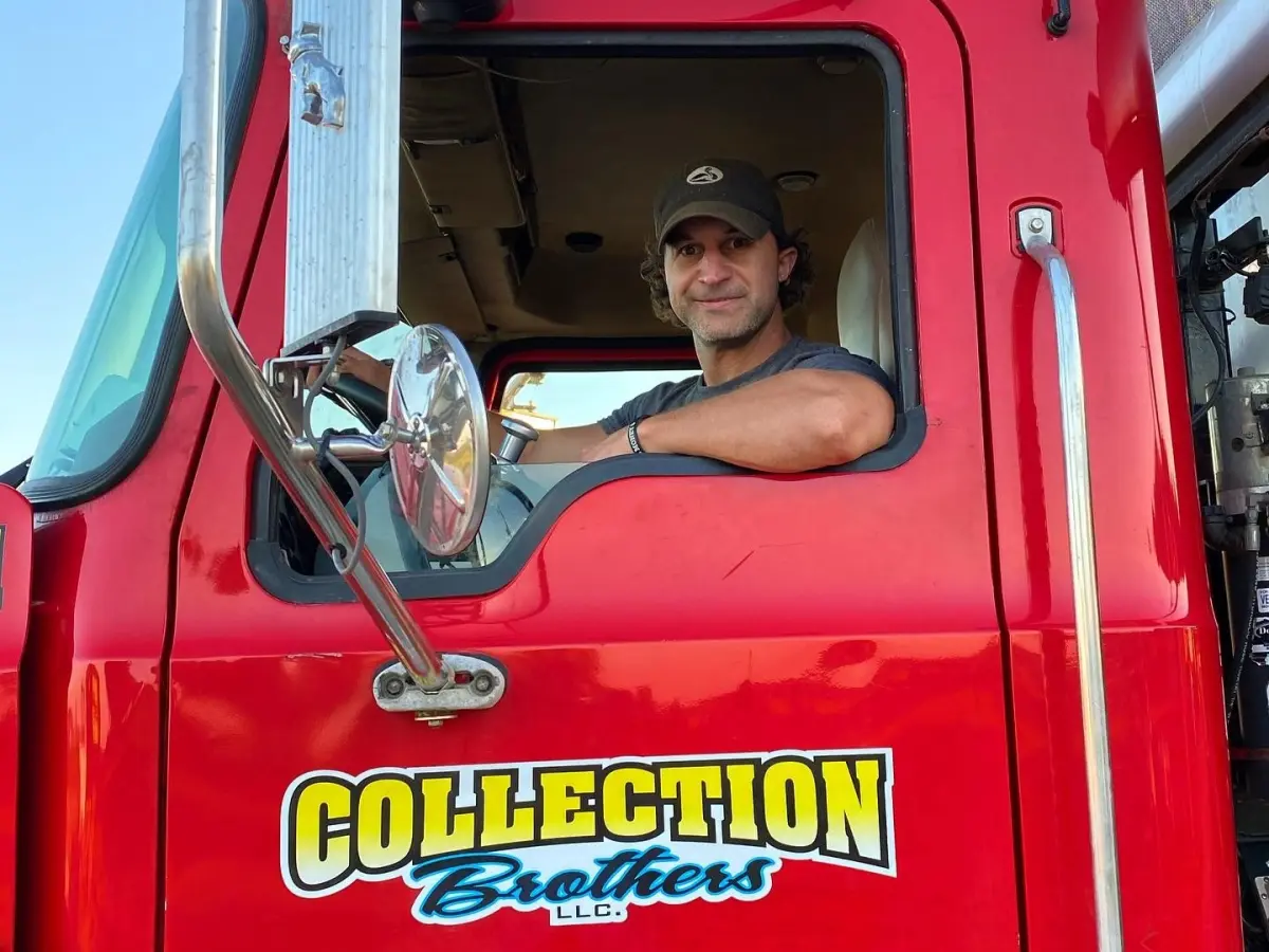 Co-owner Brian Waller in a red Collection Brothers roll-off truck