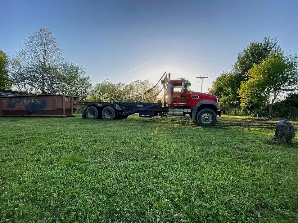 Collection Brothers roll-off truck ready to deliver a cleanout dumpster